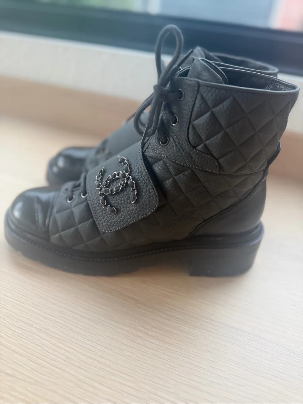 CHANEL Black Quilted Leather Combat Boots with Patent Toe